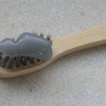 Charcoal toothpaste on a toothbrush - WikiMedia Commons, no author attribution provided