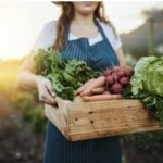 Woman with vegetables.