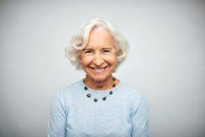 An age-gifted woman with a beautiful smile.